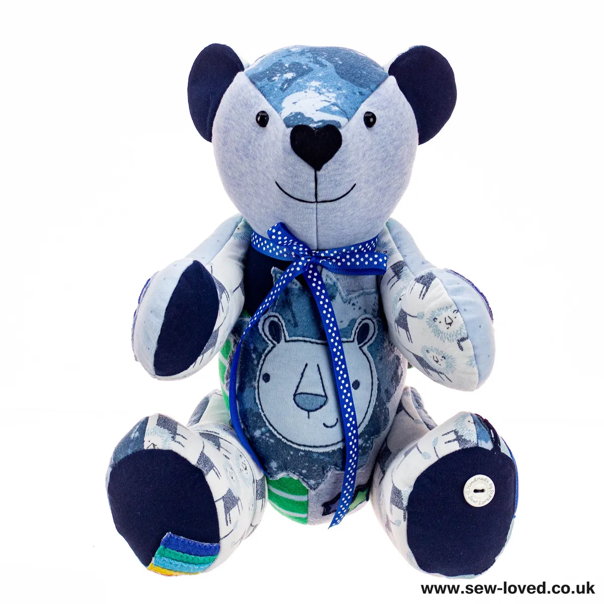 A keepsake bear made from baby clothes, with a blue bow